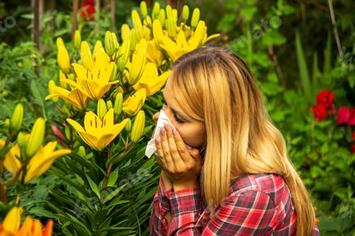 Preview: Girl's allergy to flowers. Selective focus