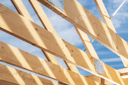 Preview: A Wooden Framework is Being Constructed With Beams and Metal Connectors