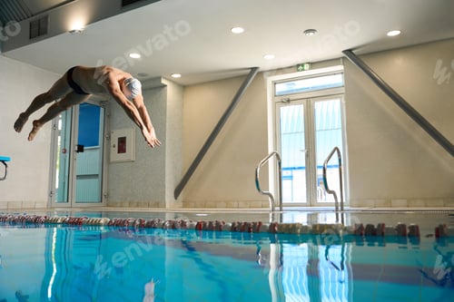 Preview: Male in white cap jumping into water