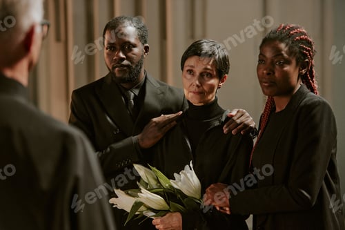 Preview: Family and Priest in Church