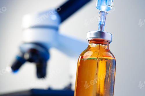 Preview: Medical vial with medication and syringe close up