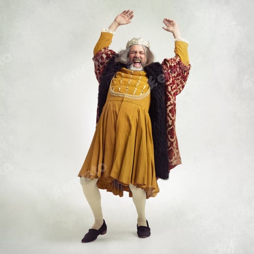 Preview: Shake like youre royalty. Shot of a bearded king laughing hysterically.