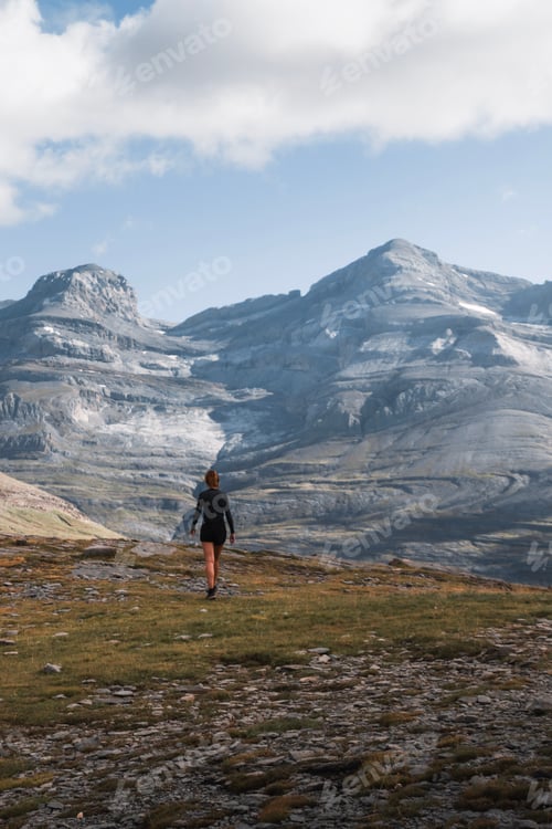 Preview: Woman walks through the Pyrenees mountains with views of Monte Perdido