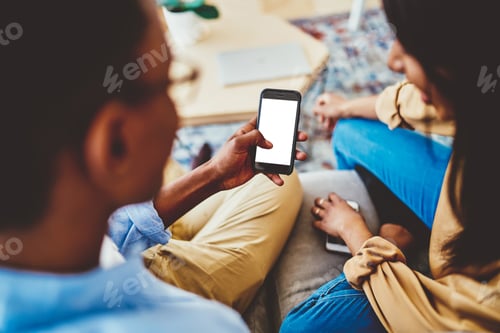 Preview: millennial hipsters browsing blank website on cellular
