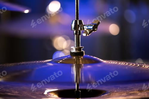 Preview: Drum cymbal close-up on a dark blurred background.
