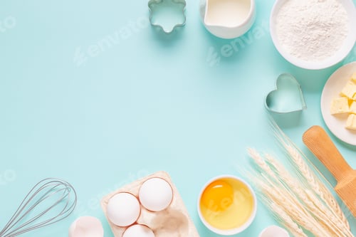 Preview: Ingredients for baking on light blue background.