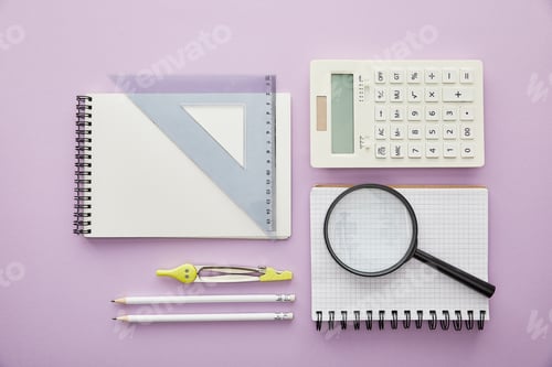 Preview: top view of magnifier and ruler triangle on notebooks near calculator and stationery isolated on
