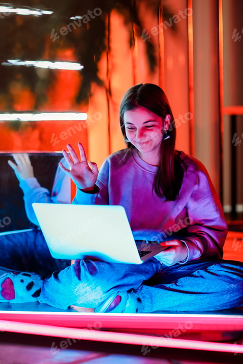 Preview: Teen girl watching video on laptop