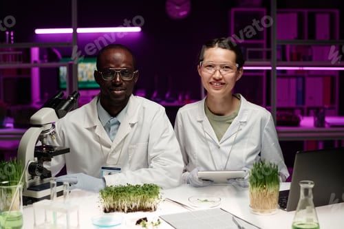 Preview: Two Researchers Working with Plants Together in Laboratory