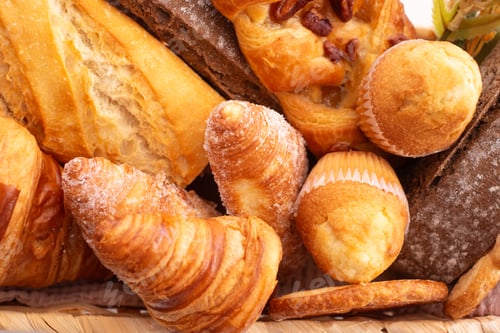 Preview: Close-up on bakery - various kinds of breadstuff. Rye bread, wholemeal, baguette, bakery products