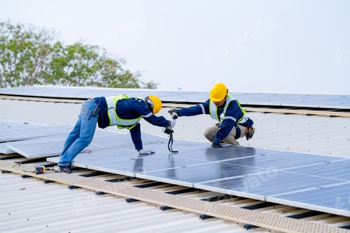 Preview: workers installing solar panels, for efficient energy on rooftop