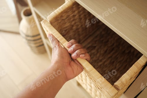 Preview: Organizing a woven basket on a wooden shelf