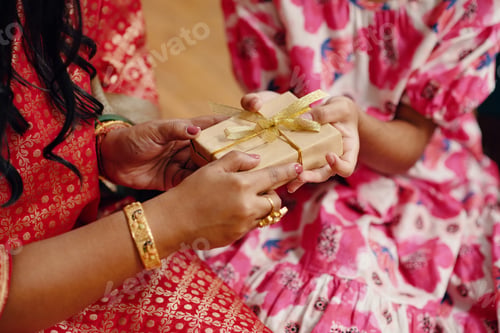 Preview: Exchanging Gift Wrapped In Gold Ribbon Between Two People
