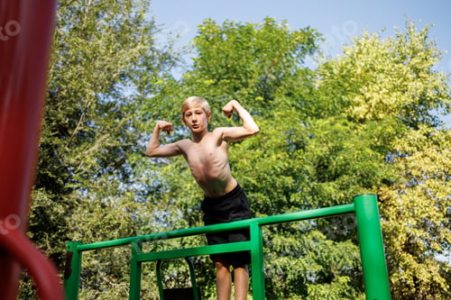 Preview: Street workout on a horizontal bar in the school park.