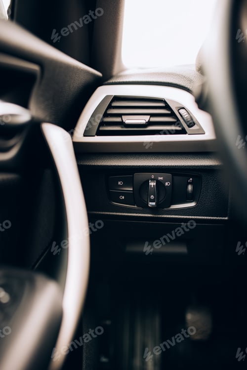 Preview: CLose up interior of modern car, details of light switch and ventilation holes