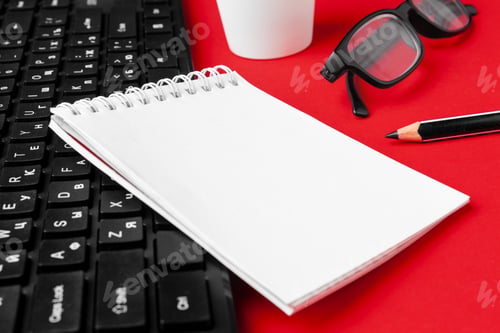 Preview: Set of stationery items on red office desk