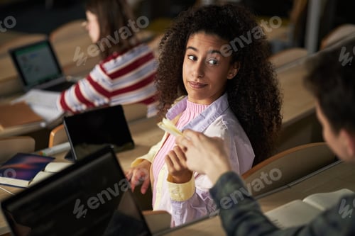 Preview: Young Adult Multiethnic Students Interacting during University Lecture
