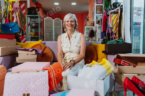 Preview: Senior woman selling clothes and accessories online.