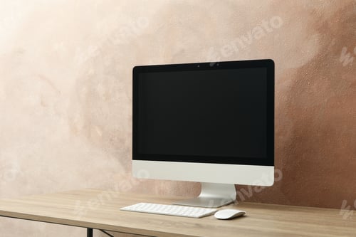 Preview: Workplace. Computer and keyboard on wooden table. Light brown background