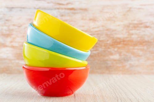 Preview: Ceramic bowl assorted colors on wooden background