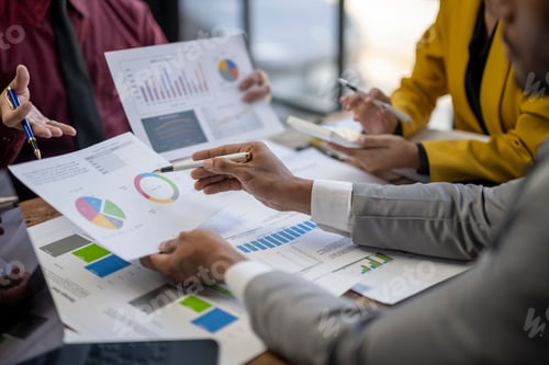 Preview: Business Professionals Analyze Charts and Graphs in Office