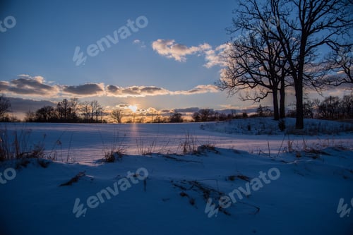 Preview: Sunset on icy blue winter landscape