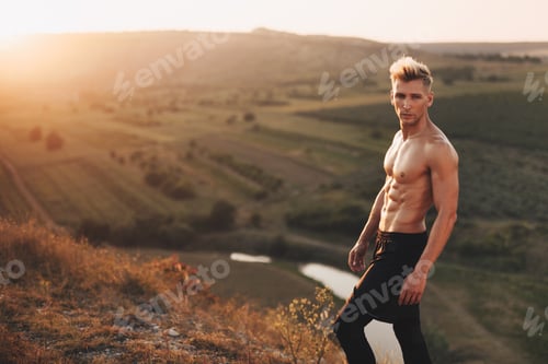 Preview: Sportive man posing on nature
