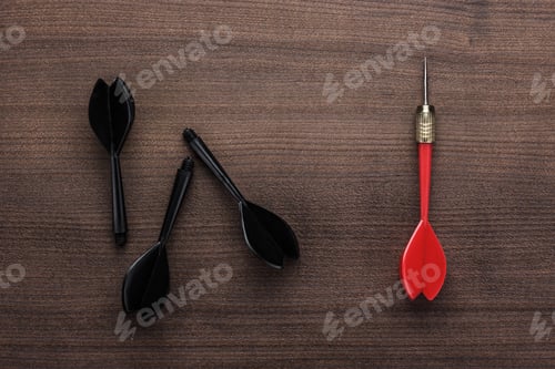 Preview: Red Dart Uniqueness Concept On Wooden Background