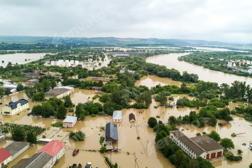 Preview: Aerial view of flooded houses with dirty water of Dnister river in Halych town, western Ukraine