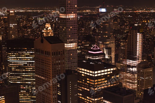 Preview: aerial view of buildings and night city lights in new york, usa
