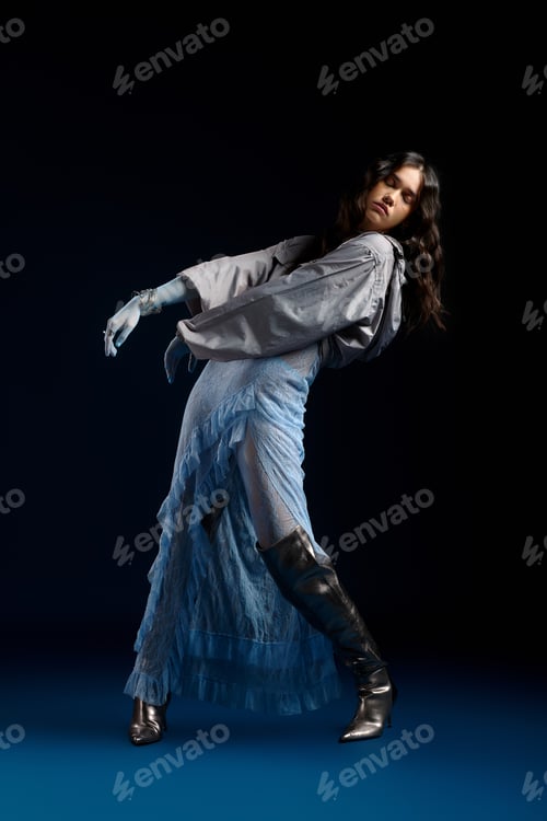 Preview: Stylish young woman showcases modern fashion in a chic studio setting