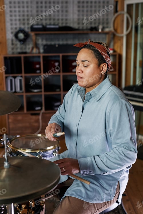Preview: Woman Playing Drums in Studio