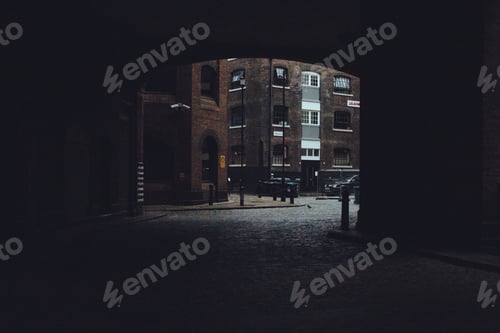 Preview: Tunnel. Buildings. Street. Urban. Bricks. Road. Exit. Depth of field. Cinematic.
