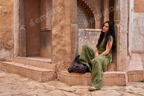 Preview: Woman on street between ancient buildings