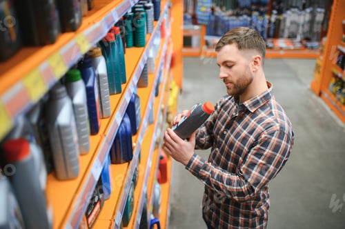Preview: man buys automobile chemicals in the auto parts store