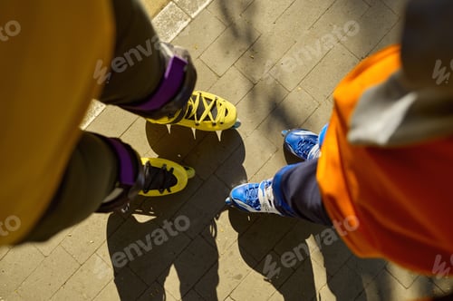 Preview: Cropped shot of man and boy legs wearing rollerblades