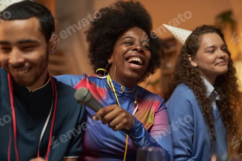 Preview: Black Woman Laughing at Party with Friends