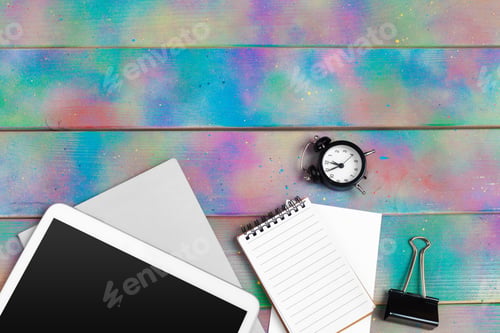 Preview: Modern blank digital tablet with papers and pen on a wooden desk. Top view. High quality