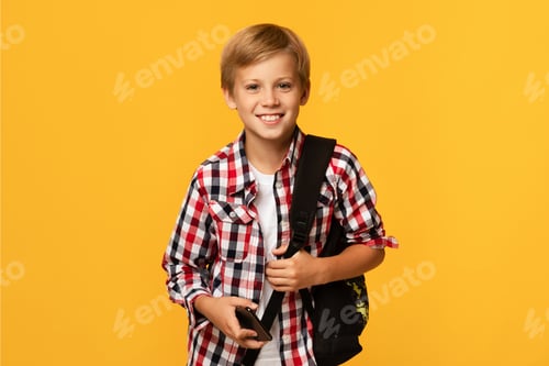Preview: Photo of charming pupil looking at camera. Modern education, knowledge concept, free space