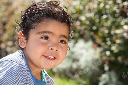 Preview: Smiling Child Posing Outdoors in Natural Light
