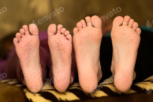 Preview: Close-up of children wrinkled feet after long bath
