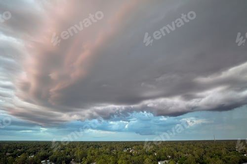 Preview: Cumulonimbus clouds forming before thunderstorm on evening sky.
