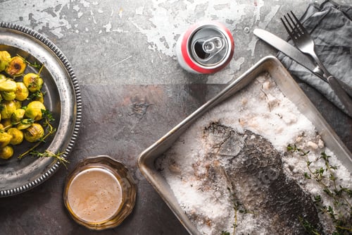 Preview: Fish baked in salt with Brussels sprouts on stone