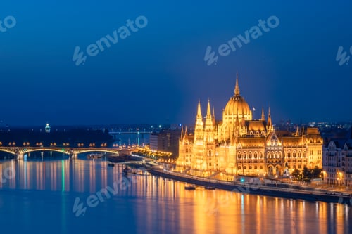 Preview: Side view of the Hungarian Parliament building illuminated in Budapest, during blue hour