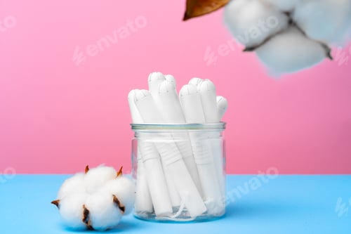 Preview: Female medical tampons on pink and blue background