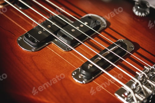 Preview: Guitar body. Close-up view of electric guitar body with metal strings and pickups. Musical