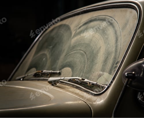 Preview: Old and retro brow car covered in dust in the garage