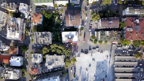 Preview: Top view of roofs and streets of city in summer. Clip. Beautiful southern city with orange roofs