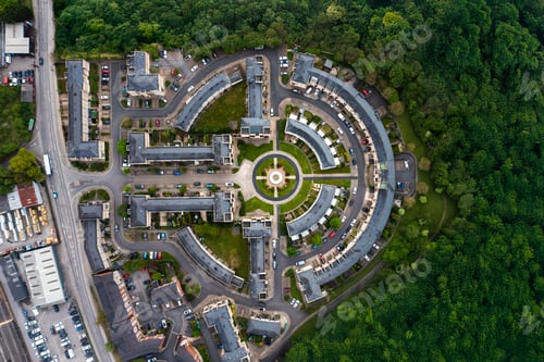 Preview: Aerial view directly above a new build housing estate in the UK with circular design