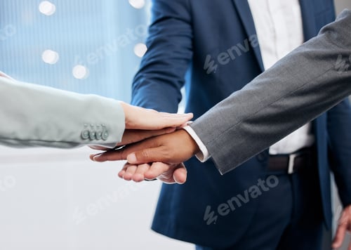 Preview: Shot of a group of businesspeople joining their hands in solidarity